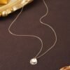 f6d2b573-df13-4dbf-8c30-1579c834e784.jpg Vintage Geometric Pattern Pendant Necklace