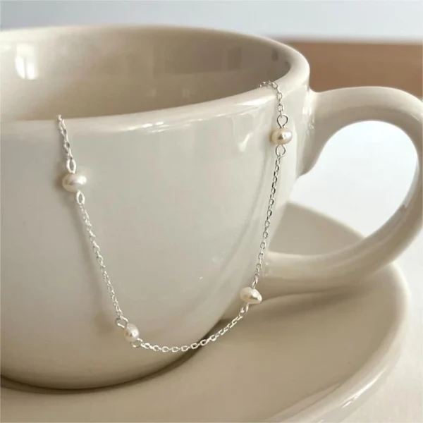 sg-11134201-7rdwh-mcb2jhvry7oxe6.webp Silver Pearl Chain Bracelet